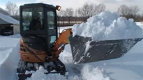 mini excavator plowing snow|mini x snow removal.